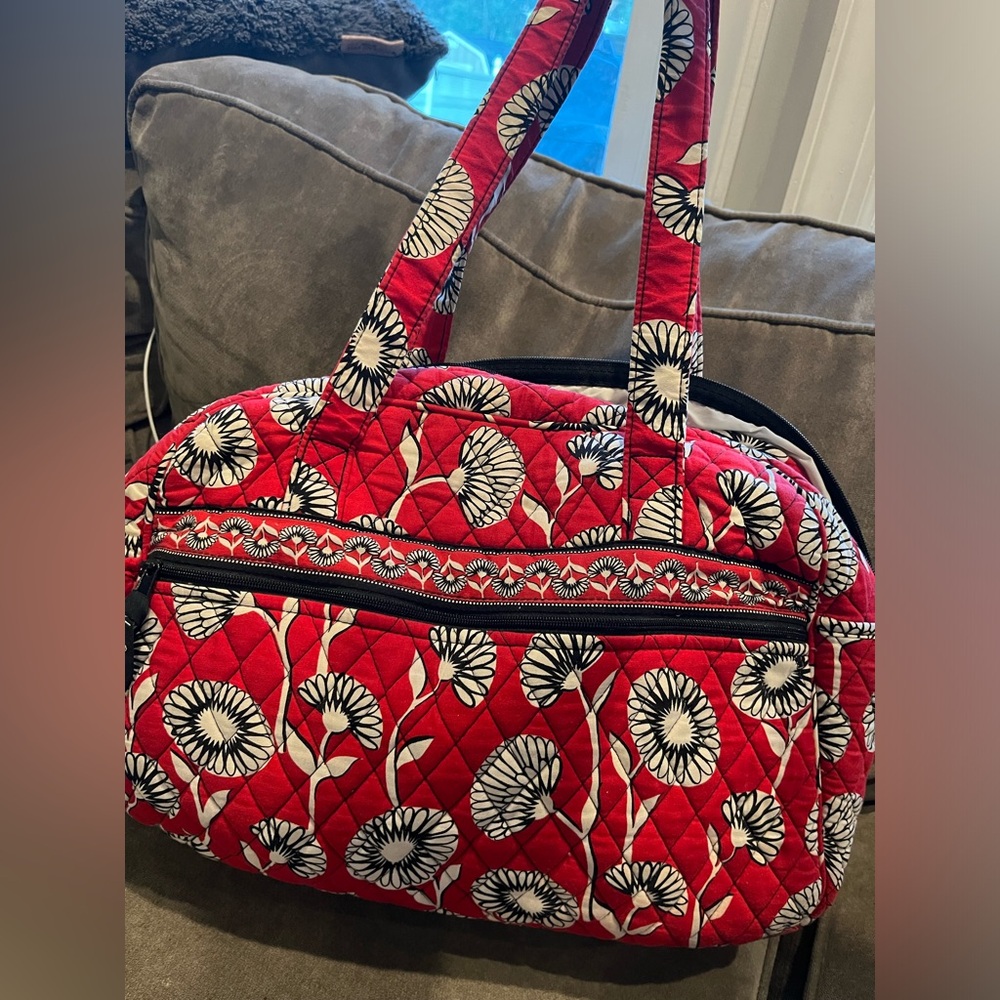 Vera Bradley diaper bag with matching changing pad. Great condition